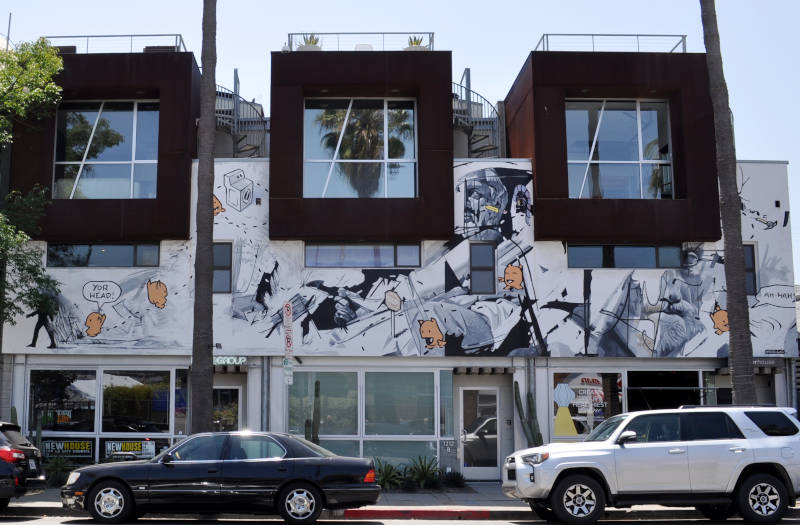 Three retail stores in a trendy building.